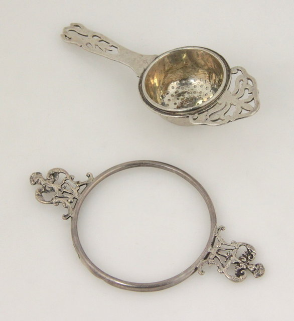 A silver tea strainer Birmingham