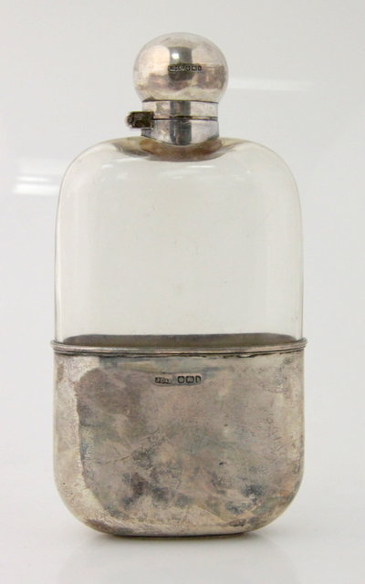 A silver mounted glass spirit flask