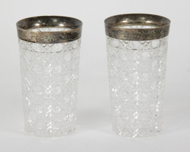 A pair of silver mounted cut glass goblets