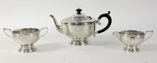 A silver three piece tea service