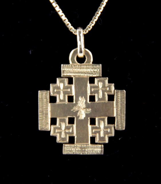 An 18K pendant of cross shape on
