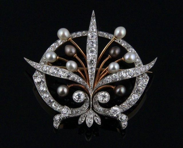 A diamond and pearl brooch modelled