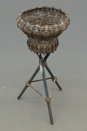 C. 1920's wicker planter in old