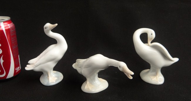 Lot three Lladro goose figurines.