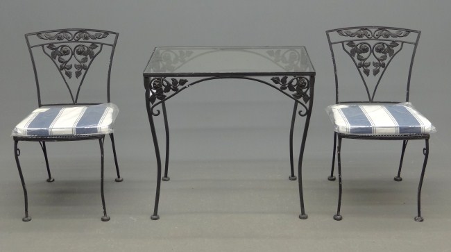 Wrought iron patio table and two
