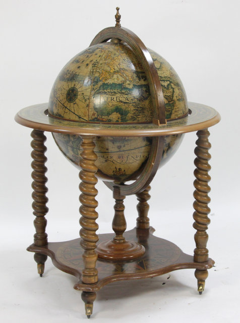 A cocktail cabinet of globe form on