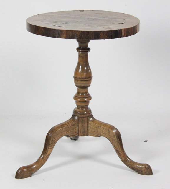 A marquetry tripod table the circular