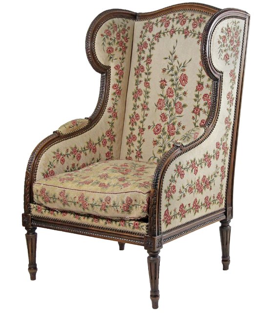 A Louis XVI style wing armchair with