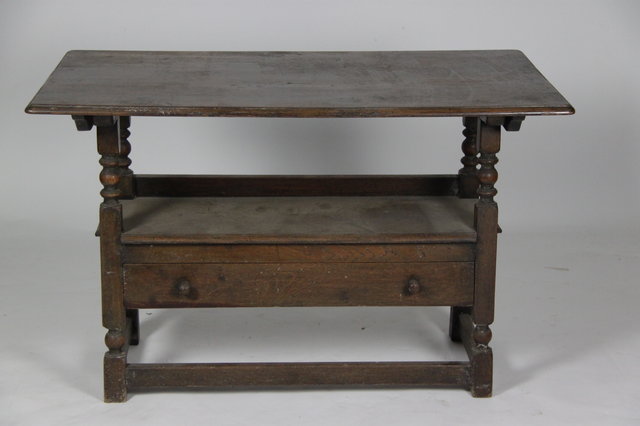 A monks bench in oak the folding top