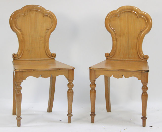 A pair of pine hall chairs