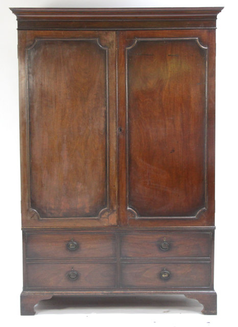 A mahogany wardrobe with cupboard doors