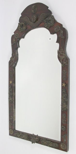 An arched mirror the bevelled plate