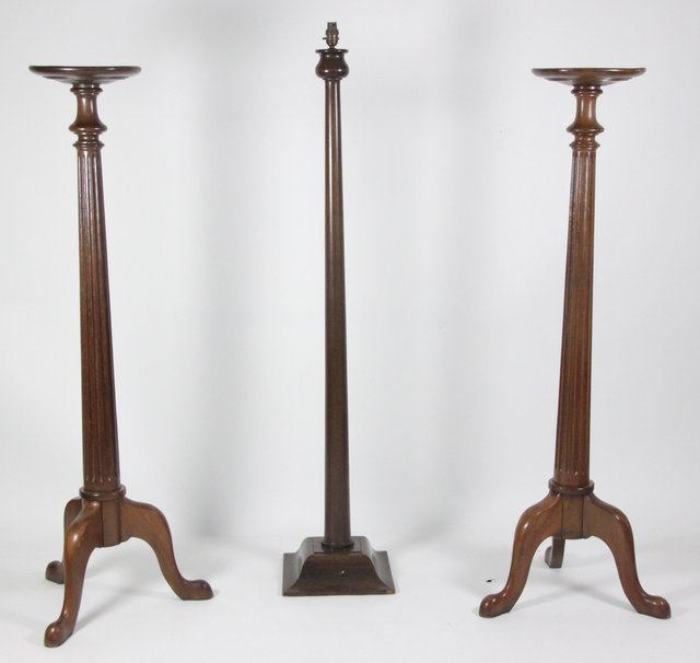 A pair of mahogany torch?res each
