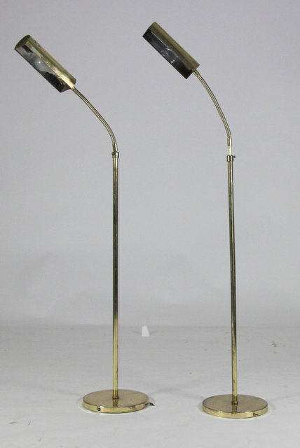 A pair of brass adjustable standard
