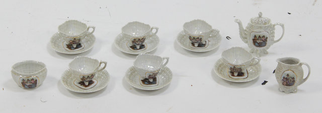 A shell moulded lustre tea set decorated