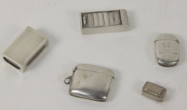 Four silver vesta cases and a vinaigrette
