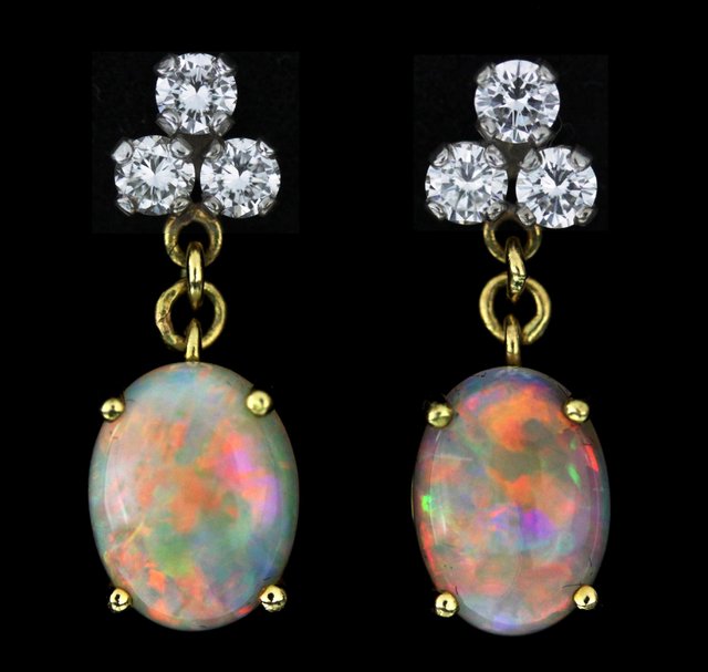 A pair of opal and diamond ear