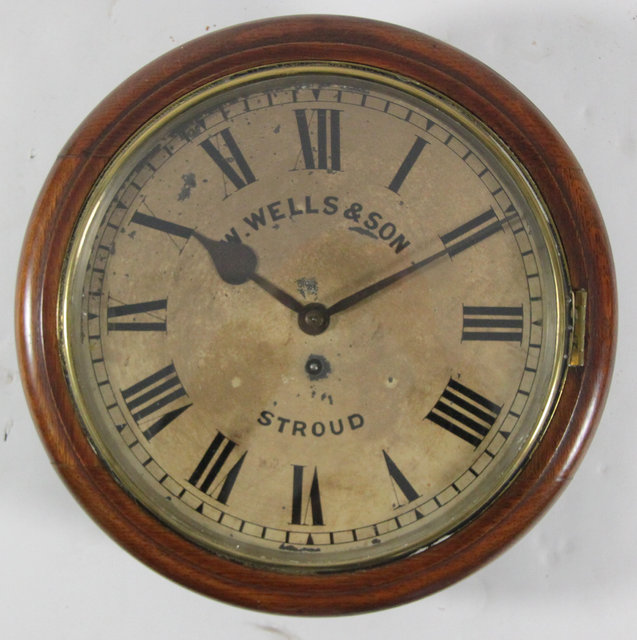 A circular wall clock the dial with