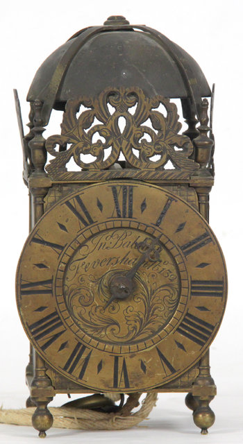 A brass lantern clock circa 1850
