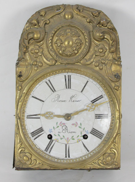 A French wall clock with embossed brass