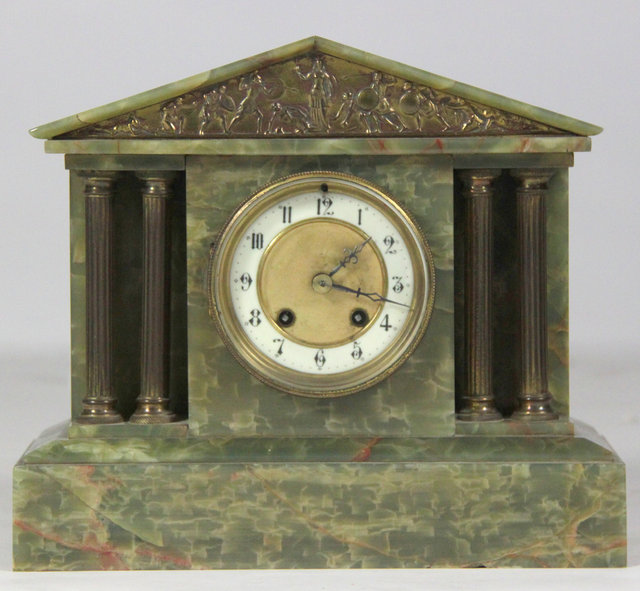 A green marble mantel clock with French