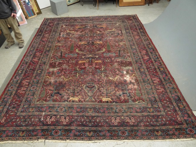 Roomsize Oriental rug with animal