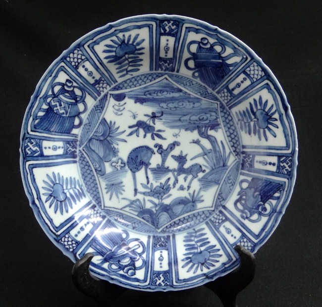 Asian dish with deer decoration.