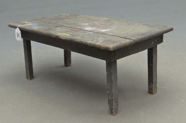 Primitive low table in grey paint.