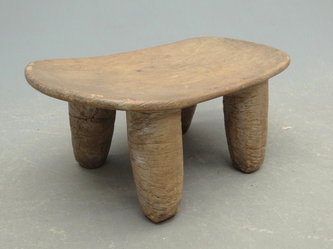 African carved stool. 27 1/2 W 11