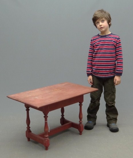 Contemporary childs table in red paint.