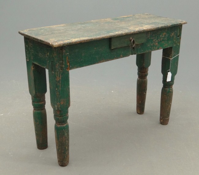 Primitive single drawer table in