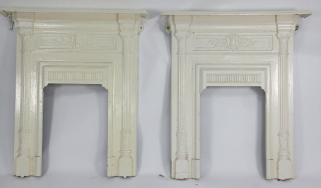 A pair of cast iron fire surrounds