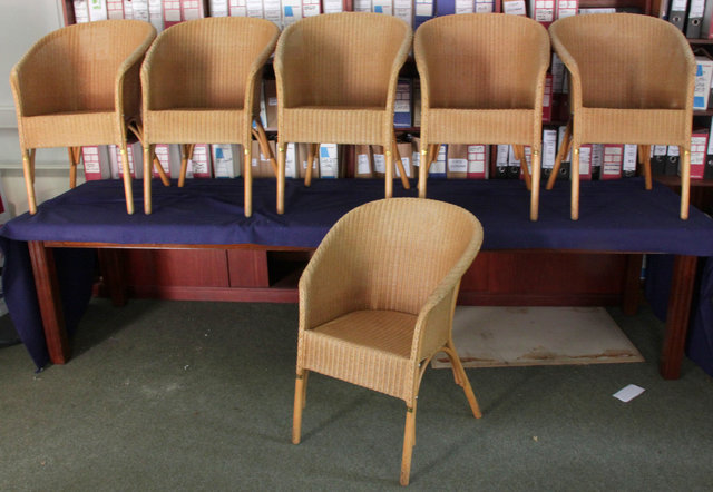 Six wicker tub shaped chairs