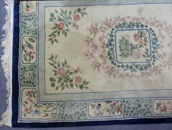 A Chinese wool carpet sewn with 164678