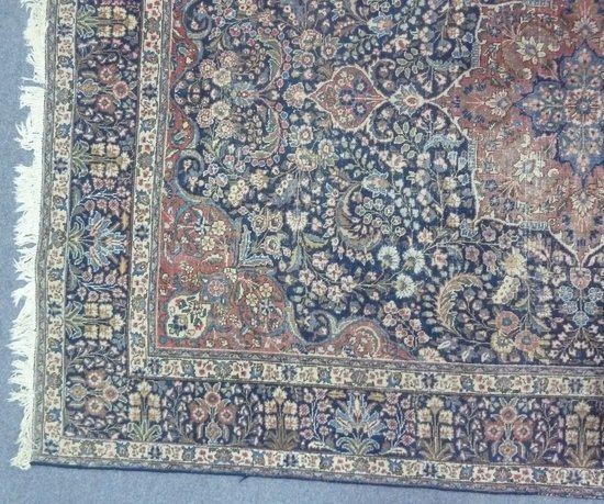 An Oriental rug with madder medallion 164679