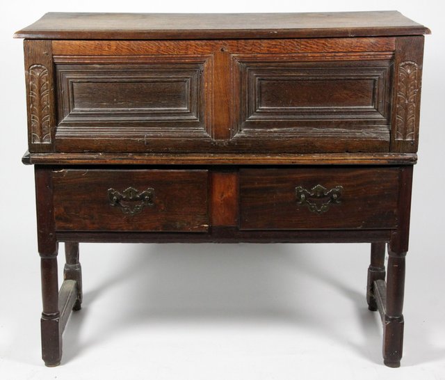 An 18th Century oak chest the hinged