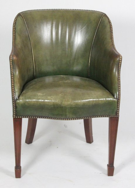 A George III style tub chair upholstered