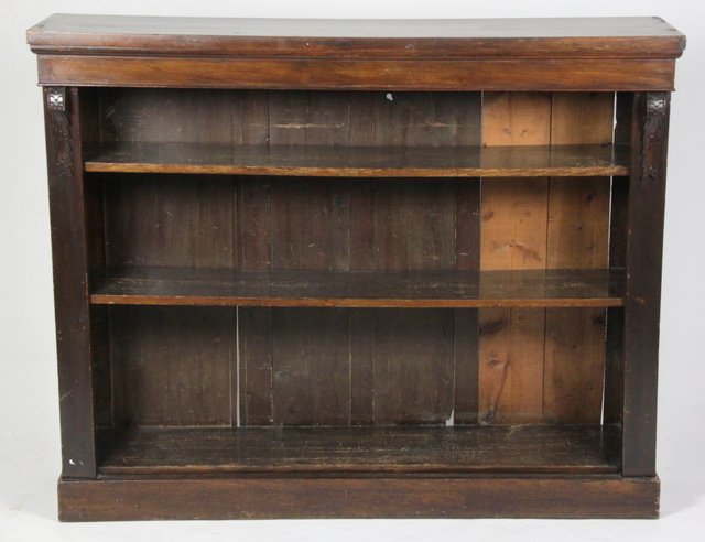 A mahogany open bookcase fitted