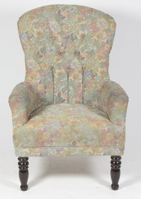 A Victorian upholstered chair on turned