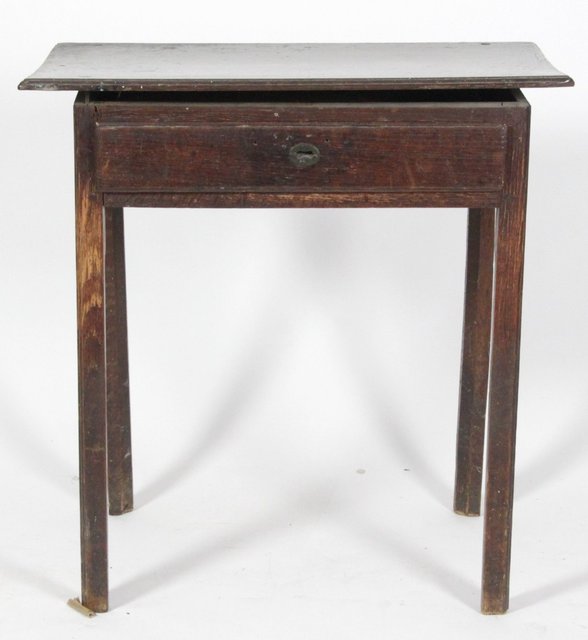 An oak table fitted a drawer on square