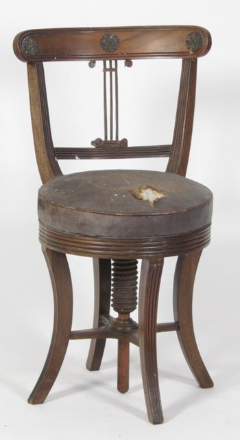 An Edwardian mahogany piano chair 164700