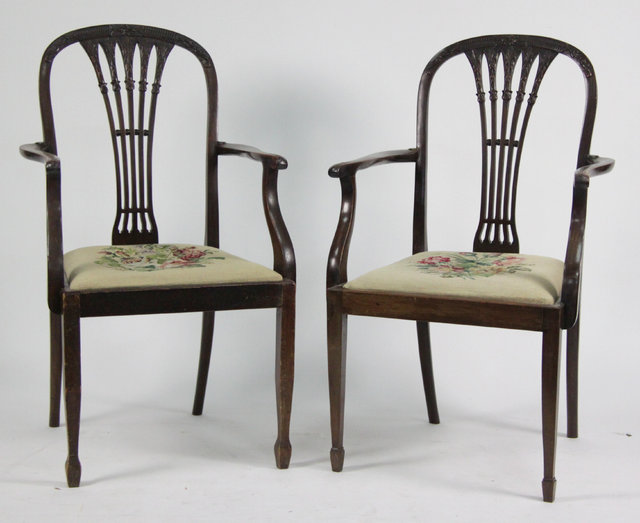 A pair of mahogany framed open armchairs