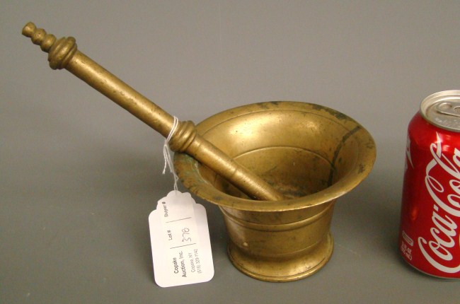 Early brass mortar and pestle.