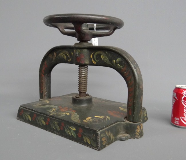 Early cast iron book press. Paint