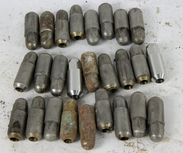 Twenty-four Alvis wheel nuts