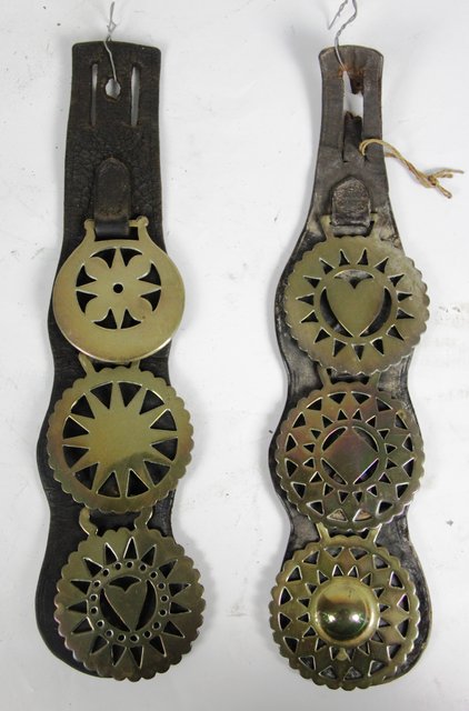 Two straps each set with three horse