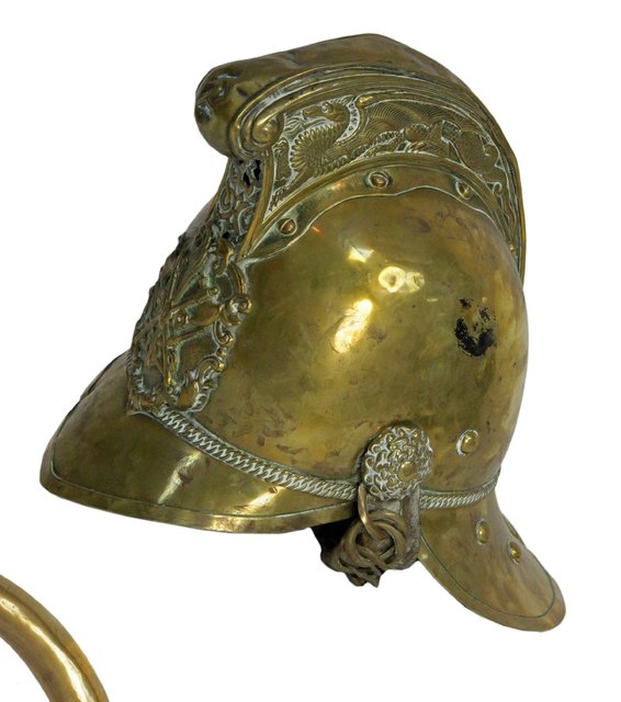 A firemans brass helmet complete with