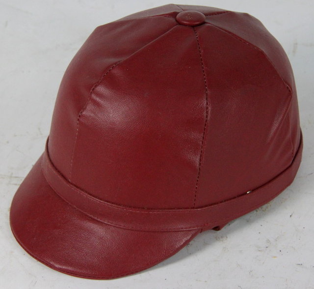 A Skulgarde red leather crash helmet