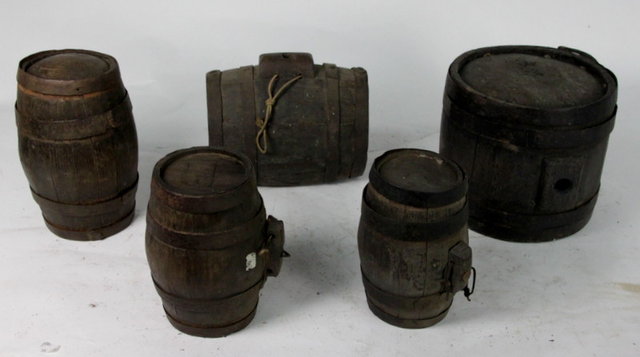 A metal bound harvest barrel and four