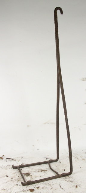 A wrought iron boot scraper